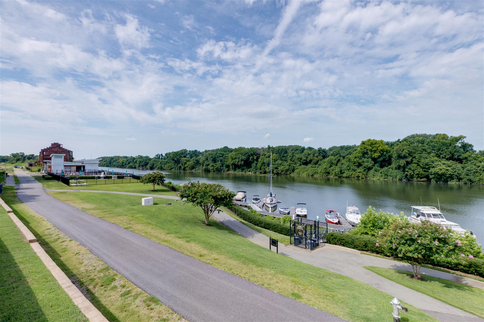a view of the river with boats docked at a dock