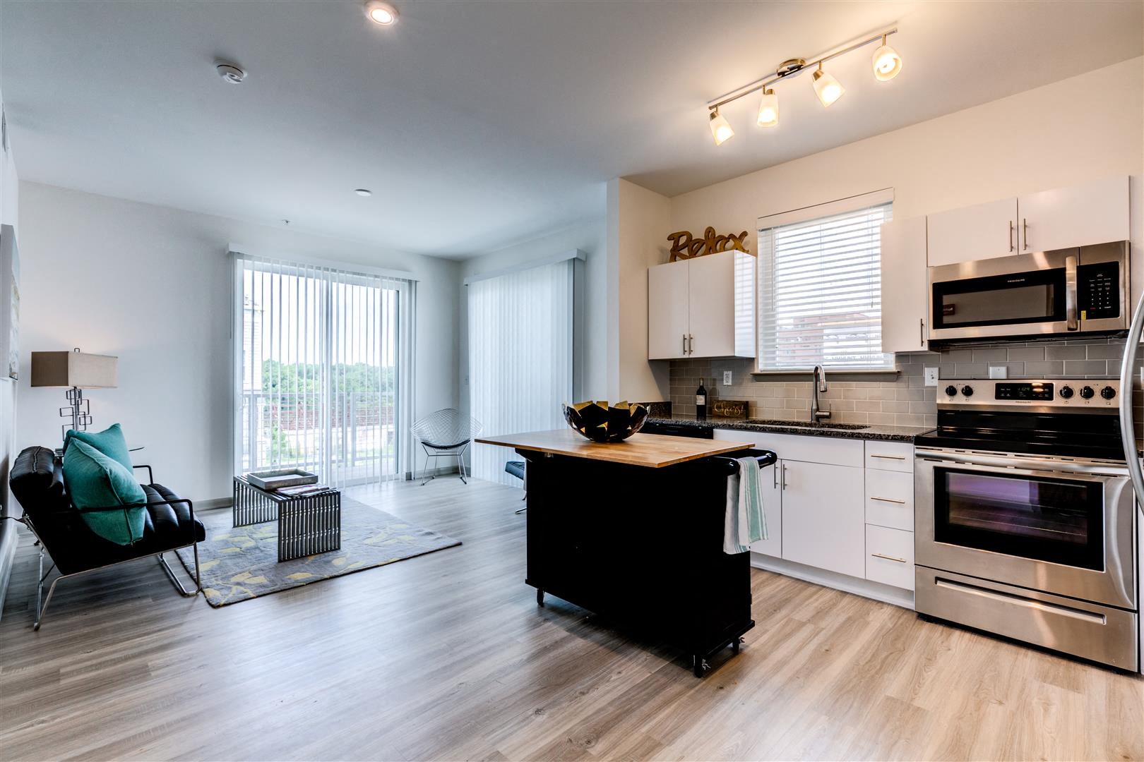 a kitchen with stainless steel appliances and a counter top