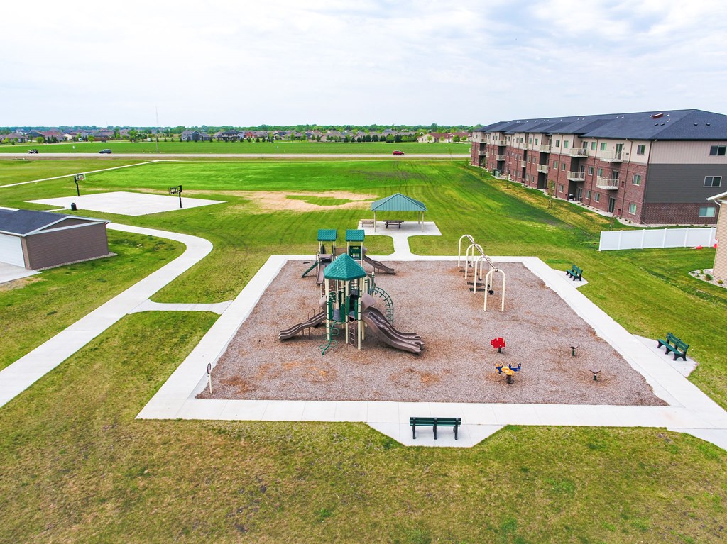 an aerial view of a playground at an apartment complex