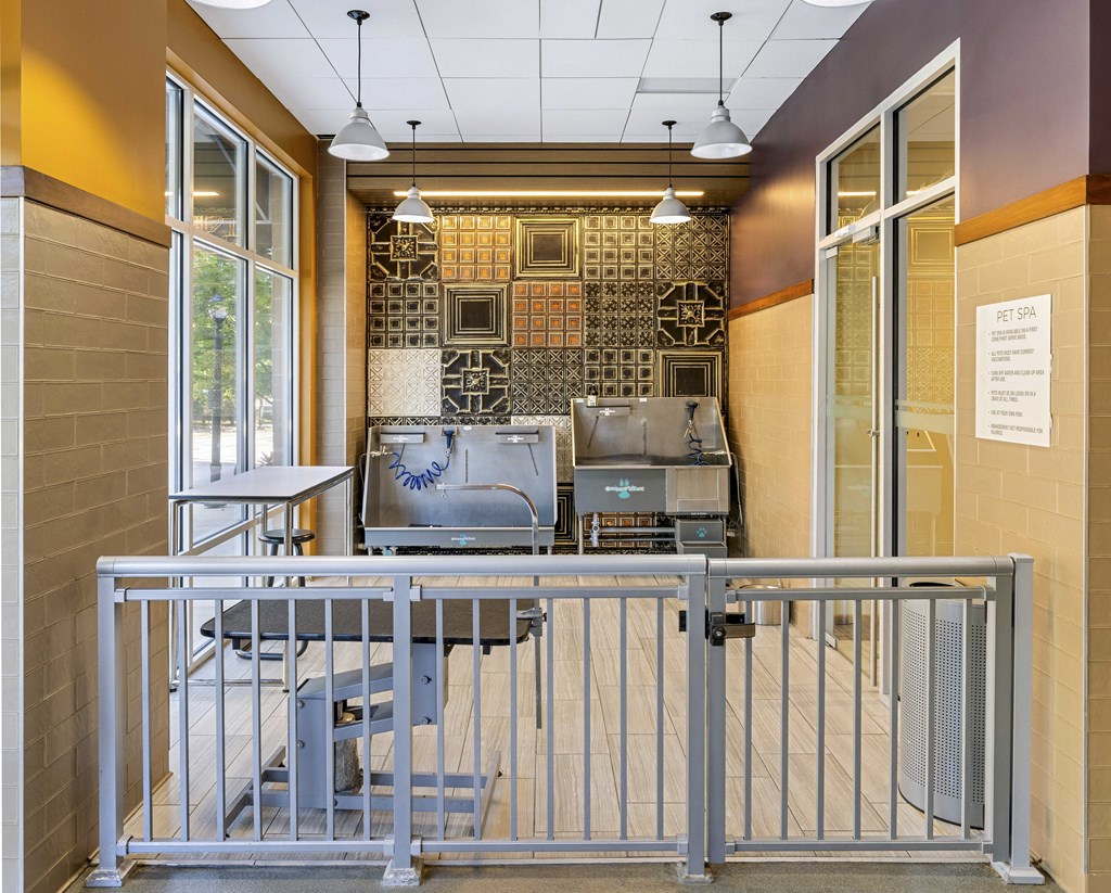 a view of the lobby of a building with tables and chairs