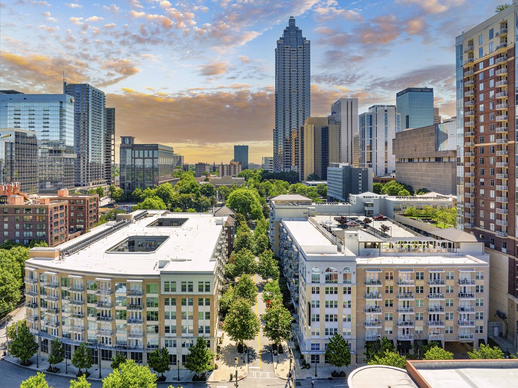 an aerial view of a city with buildings and trees