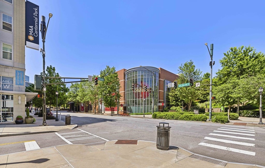 a city street with a building on the corner of a street