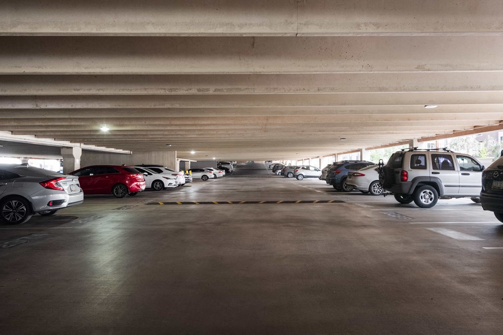a parking garage with cars parked in it