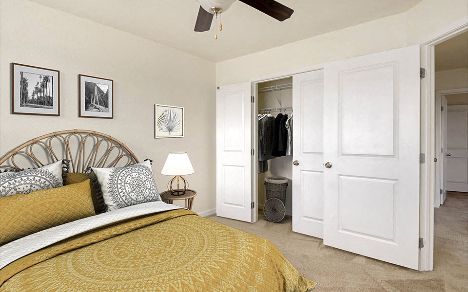 a bedroom with a bed and a closet