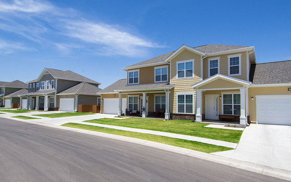 a row of houses on the side of a street