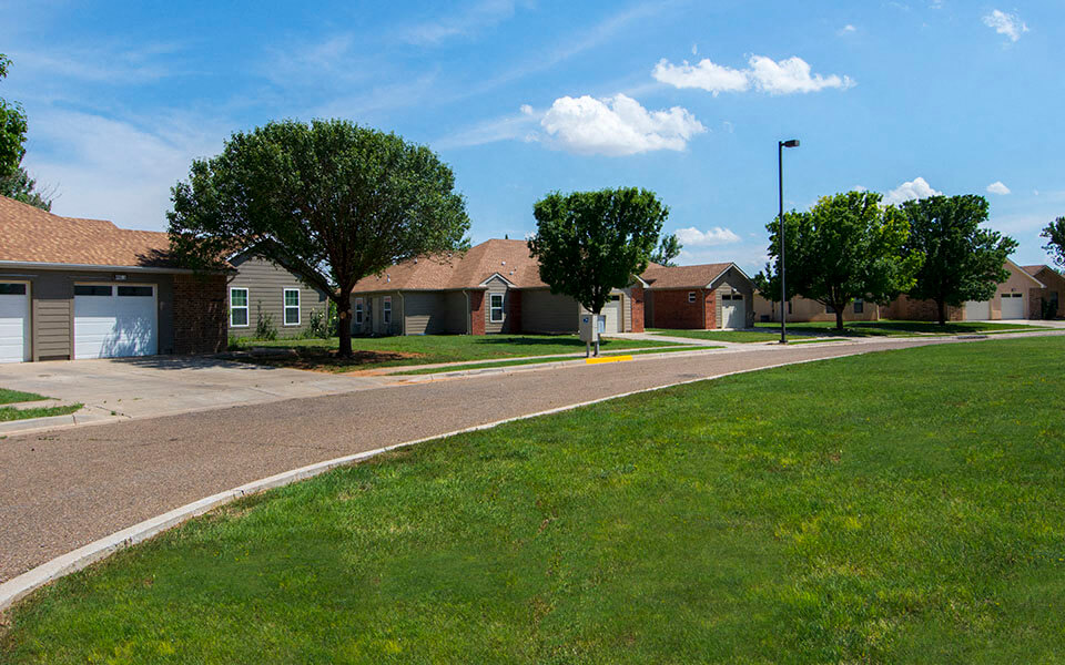a street with houses on the side of a road