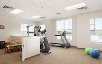 Community center with fitness and play rooms