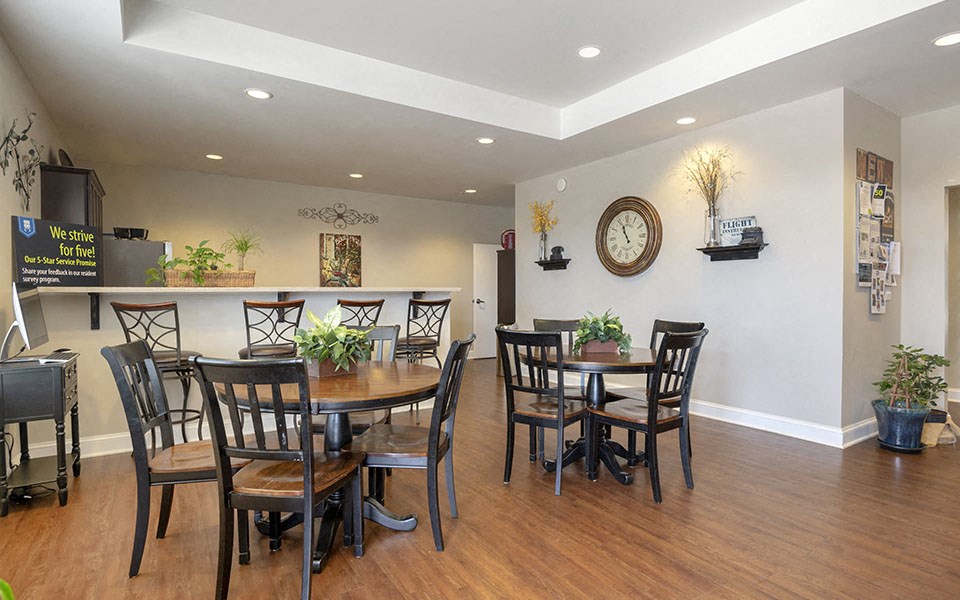 a dining room with a table and chairs