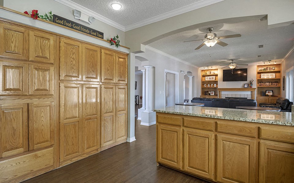 a kitchen with wooden cabinets and a counter top