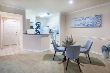 Versant Place Apartments breakfast bar in kitchen overlooking living room and dining room