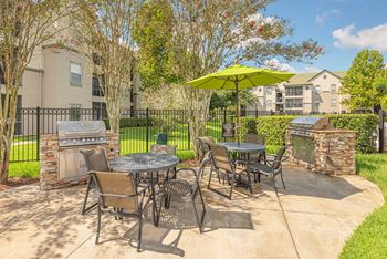Versant Place Apartments BBQ grills with entertaining areas