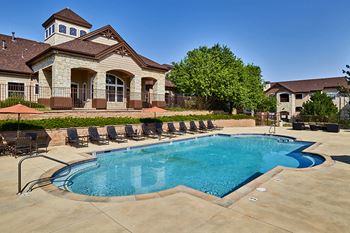Grand Centennial Apartments heated pool with landscaped terrace