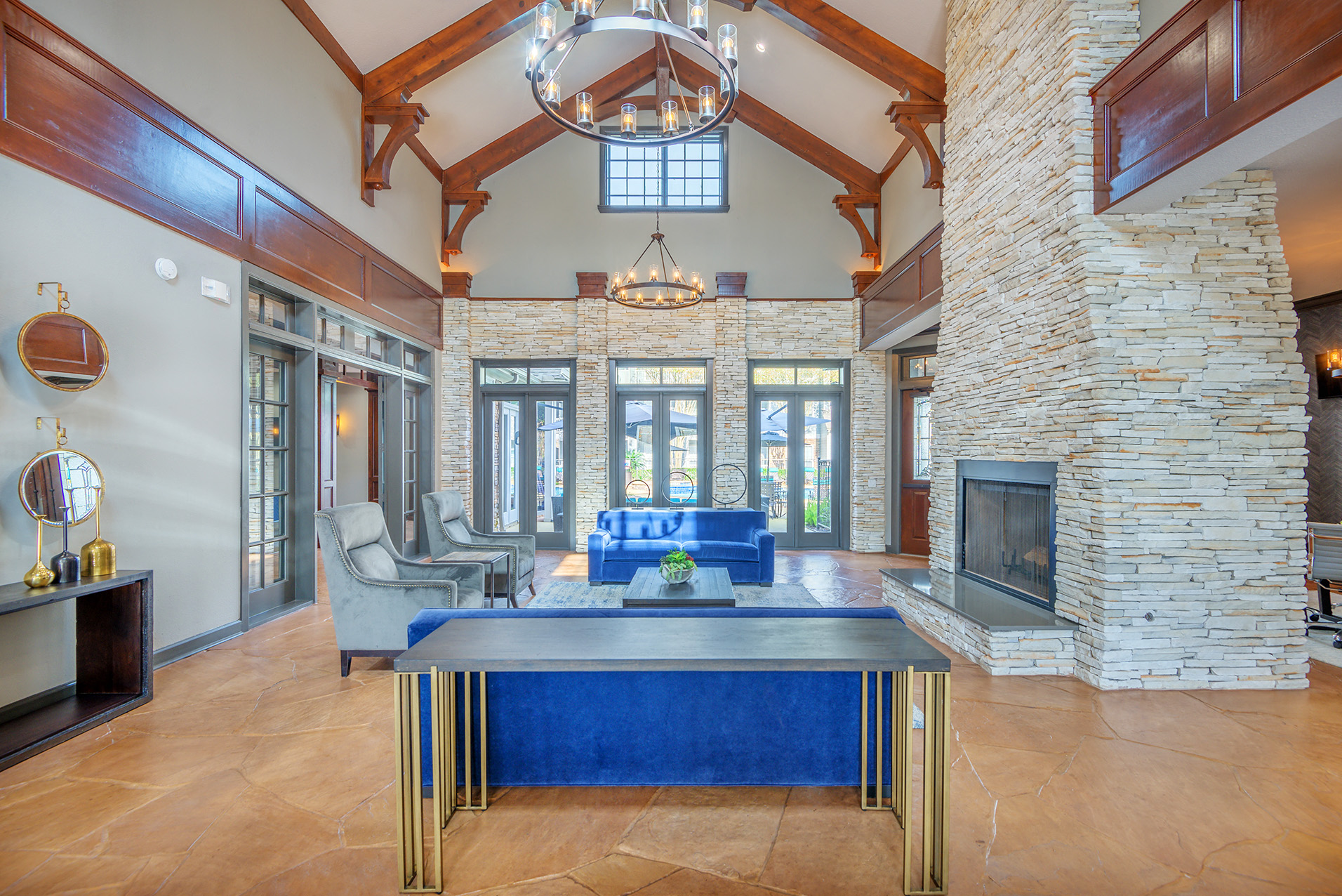 a living room with a fireplace and a blue couch