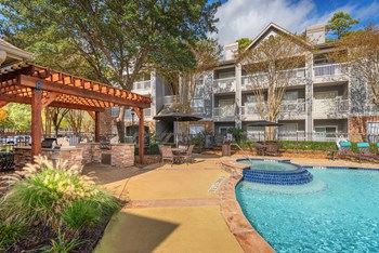 Lodge at Cypresswood Apartments - Spa with nearby BBQ grills - Photo Gallery 10