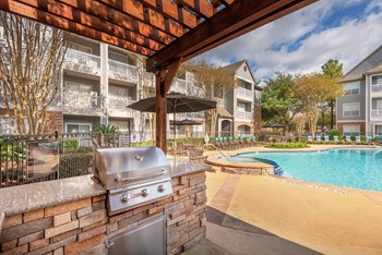 Lodge at Cypresswood Apartments - Poolside BBQ grills - Photo Gallery 13