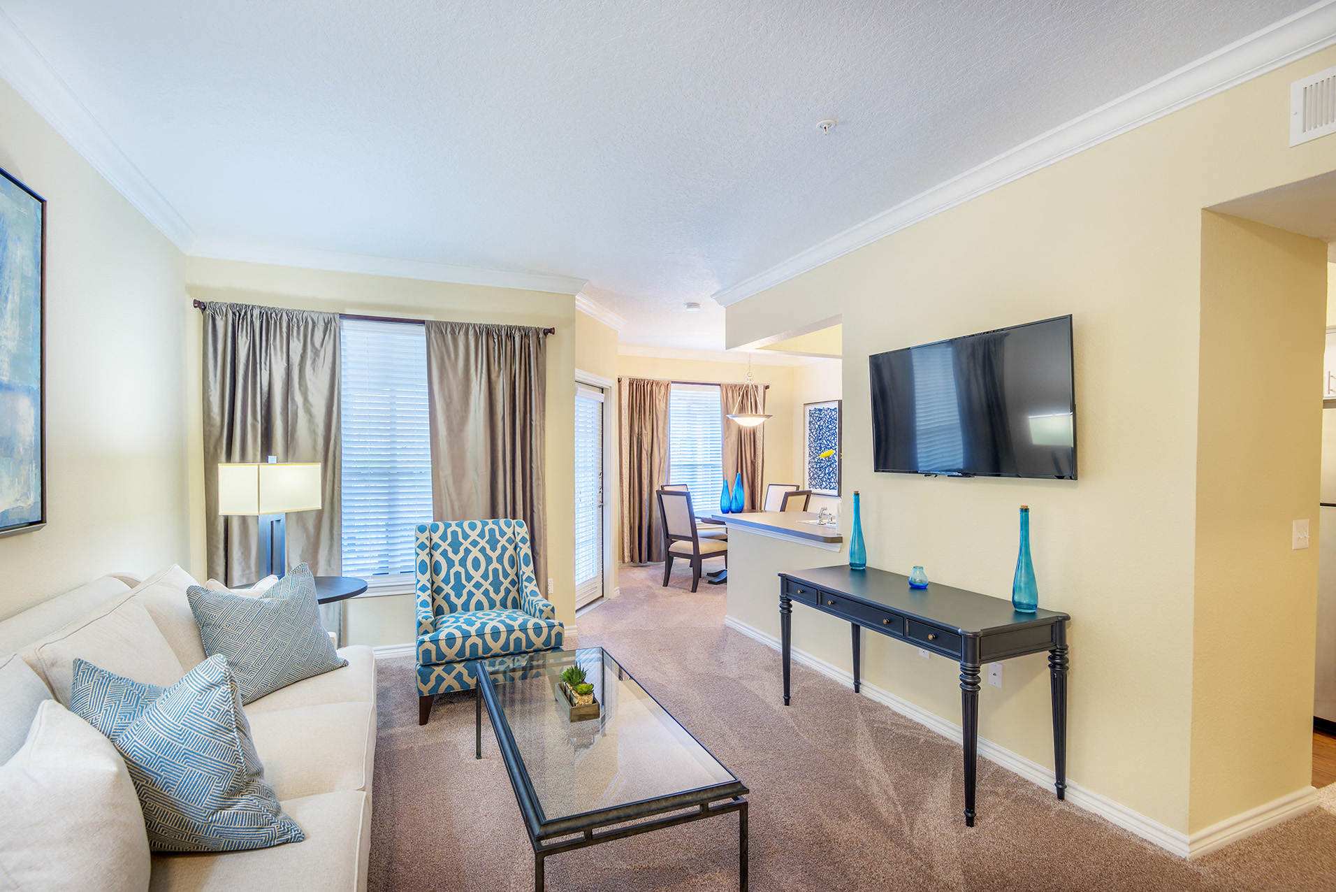 Lodge at Cypresswood Apartments - Living rooms with crown molding