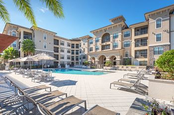 Resort-style swimming pool with hot tub