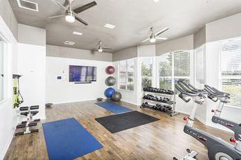Egret's Landing Apartments innovative fitness center with yoga, strength, cardio and spinning rooms