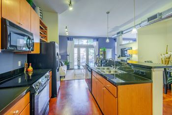 Lofts at Lakeview Apartments - Granite slab countertops