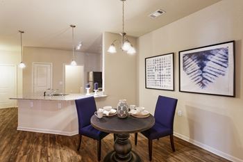 Glenbrook Apartments wood-style flooring throughout living areas and carpet in the bedrooms