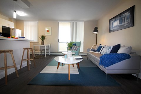 A living room with a white couch and a coffee table.