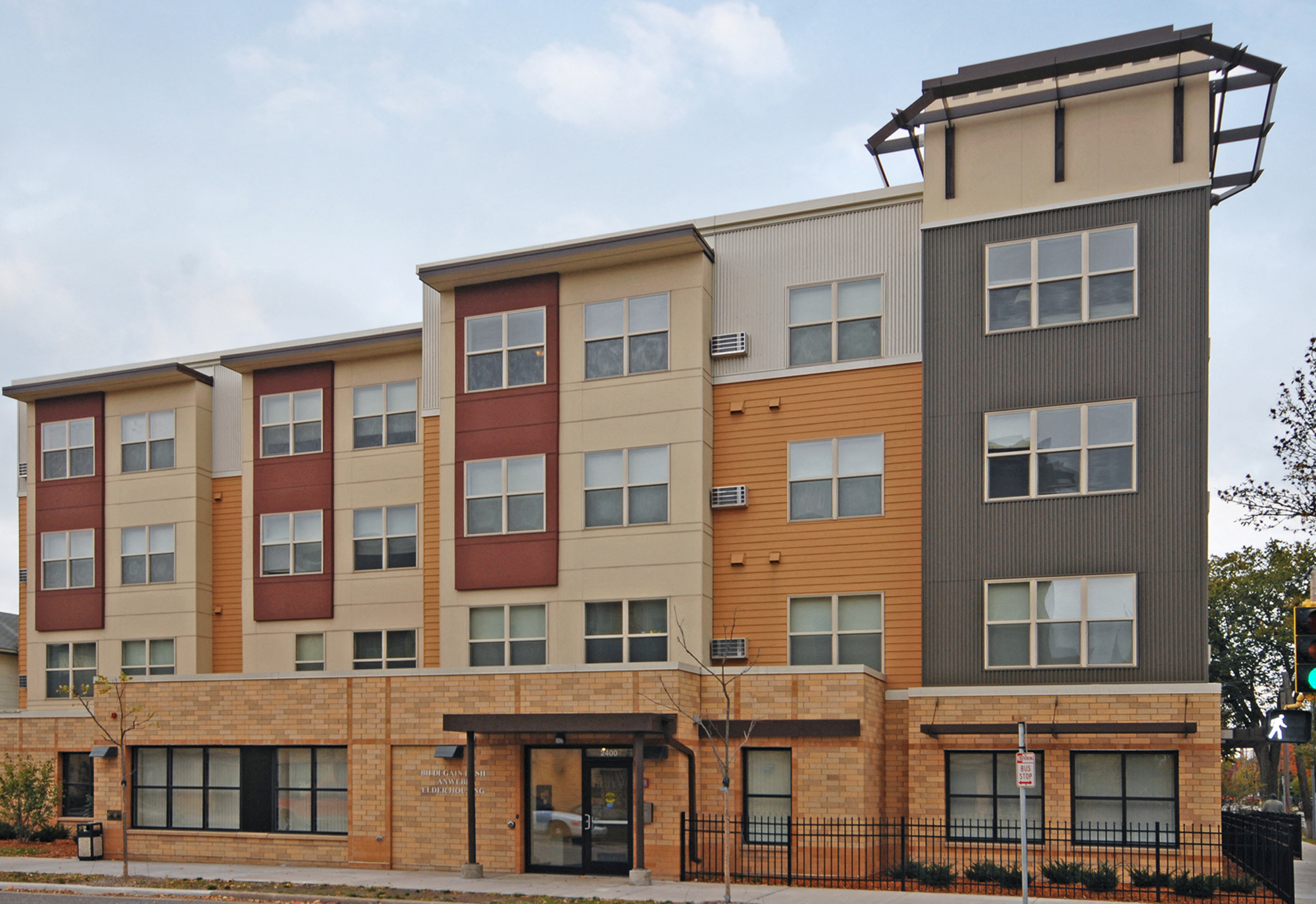 an exterior view of an apartment building on a city street