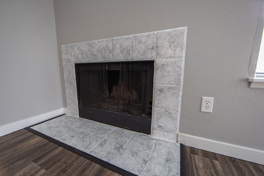 fireplace in the living room of a home with a wood floor