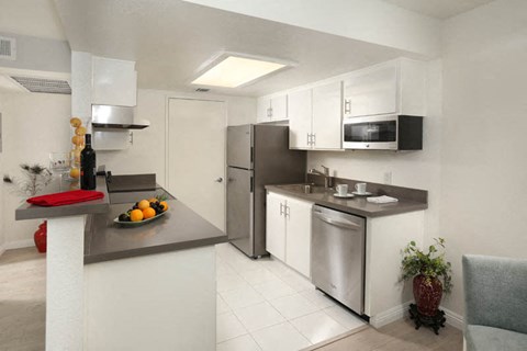 a kitchen with a sink and a refrigerator