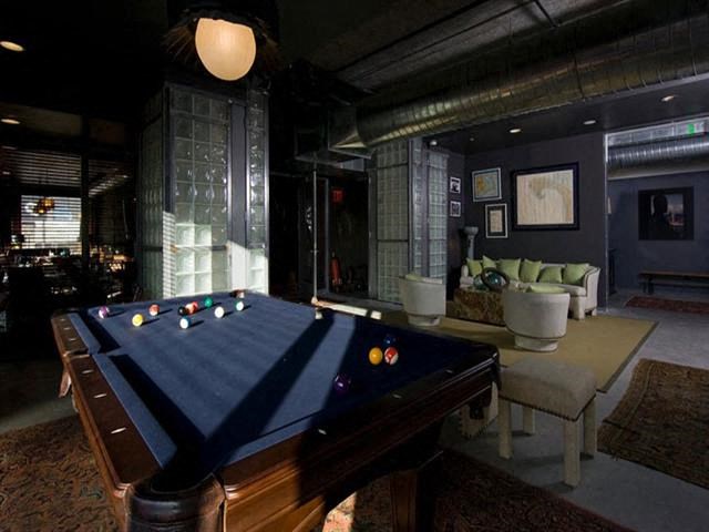 a pool table in the middle of a living room