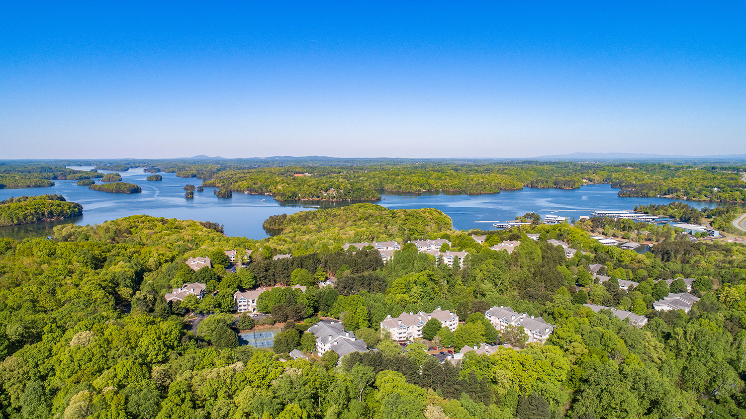a aerial view of houses in the middle of a lake