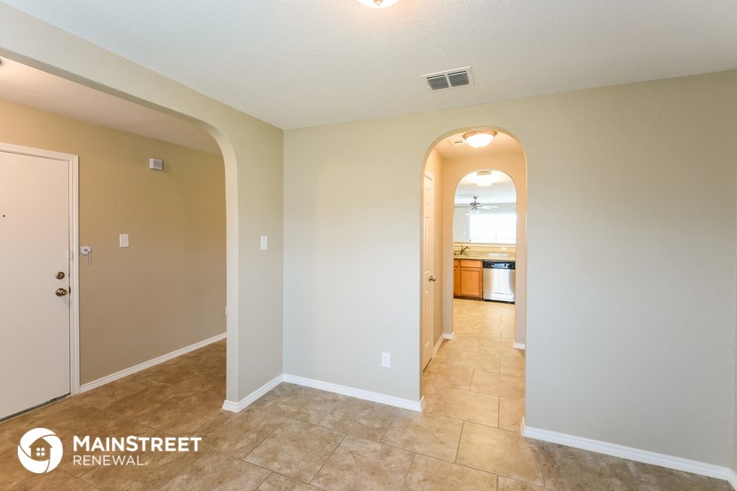 the entryway to the kitchen and living room
