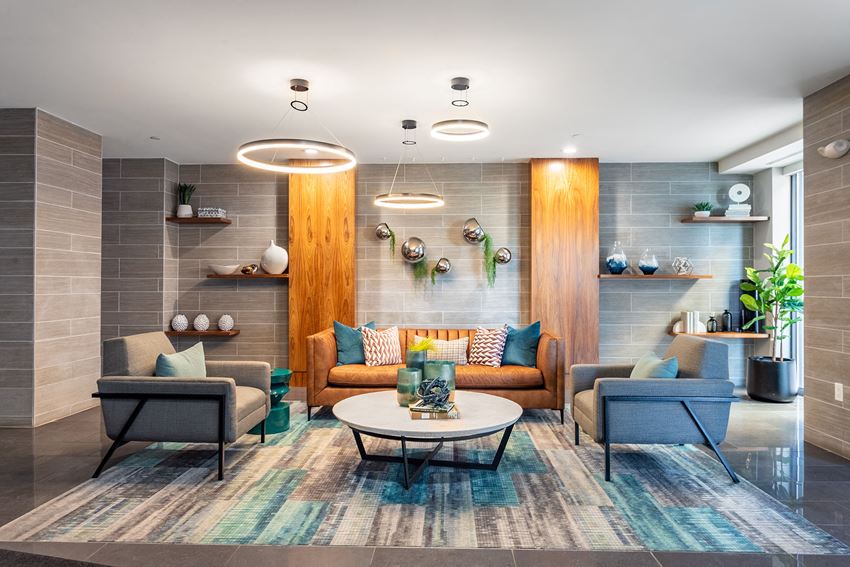 a living room with couches and chairs and a table