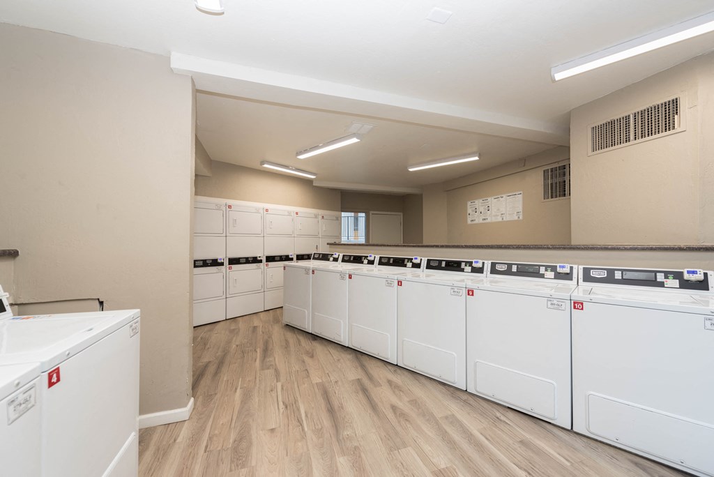 the laundry room is equipped with washer and dryer machines