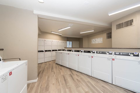 the laundry room is equipped with washer and dryer machines