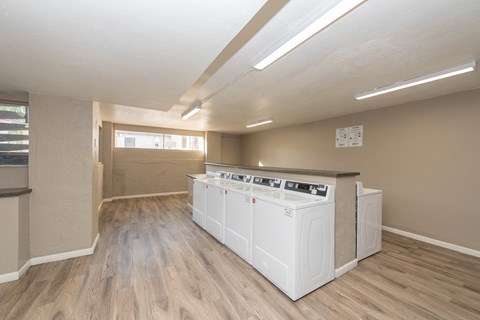 the preserve at ballantyne commons community laundry room with washer and dryer