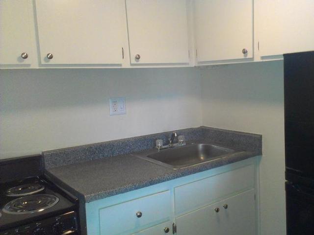 a kitchen with a sink and a stove