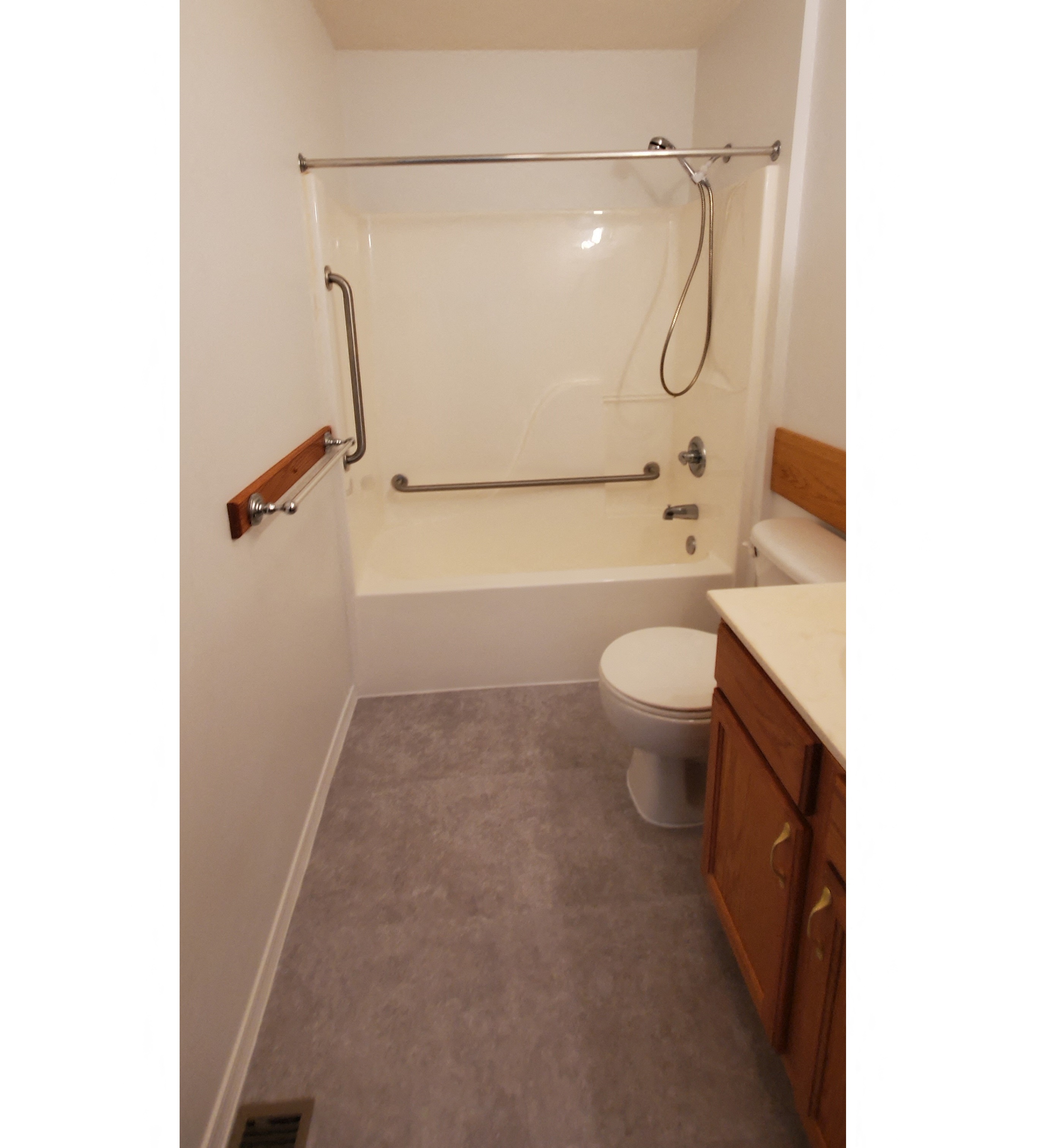 a bathroom with a toilet and a tub and a sink