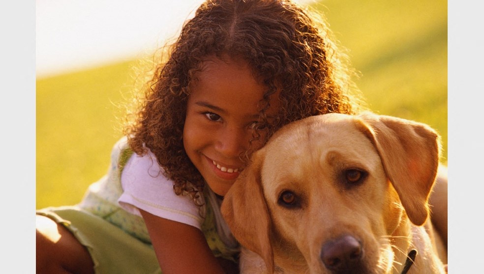 Child with dog l Waterford Cove Apartments in Sacramento CA