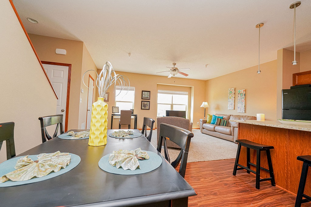 the view of the living room and dining room from the kitchen