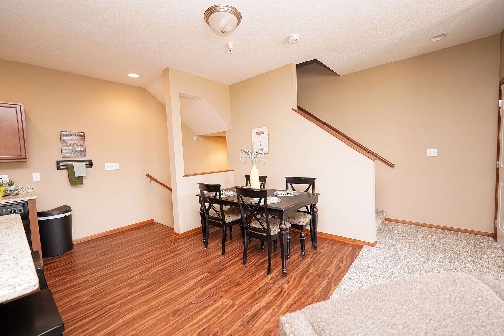 a dining room with a table and chairs