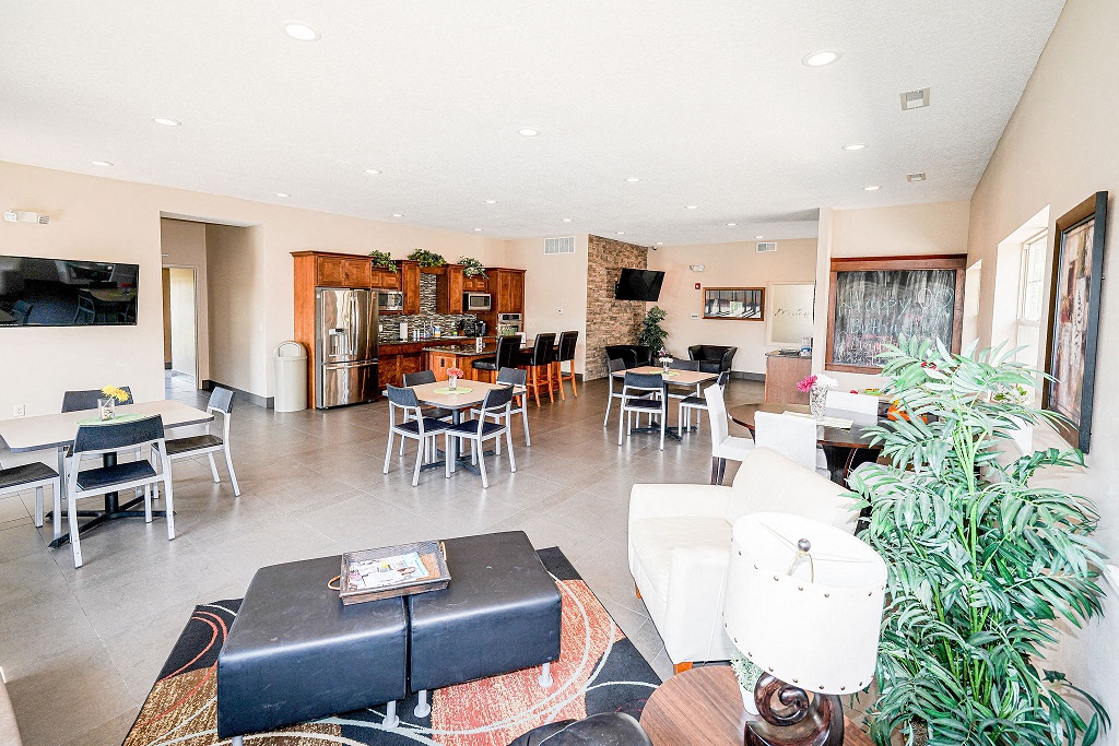 a view of the living room and dining room of a home with a large living