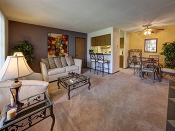Modern Living Room With Kitchen View at Stonewood Village Apartments, Madison, Wisconsin