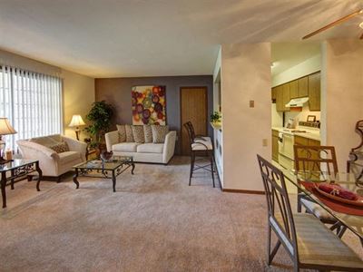 Living Room With Kitchen View at Stonewood Village Apartments, Madison