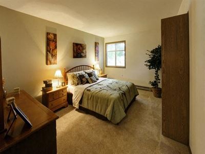 Bedroom With Expansive Windows at Stonewood Village Apartments, Wisconsin