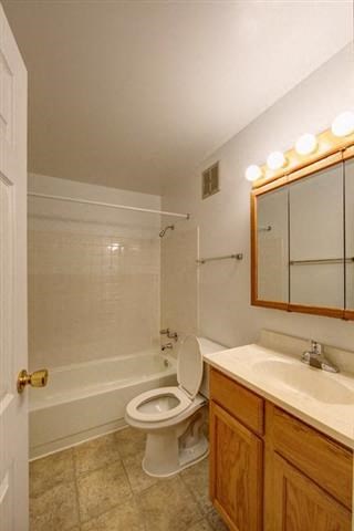 a bathroom with a toilet and a sink and a mirror