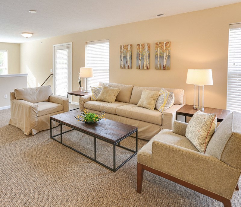 a living room with a couch and a table