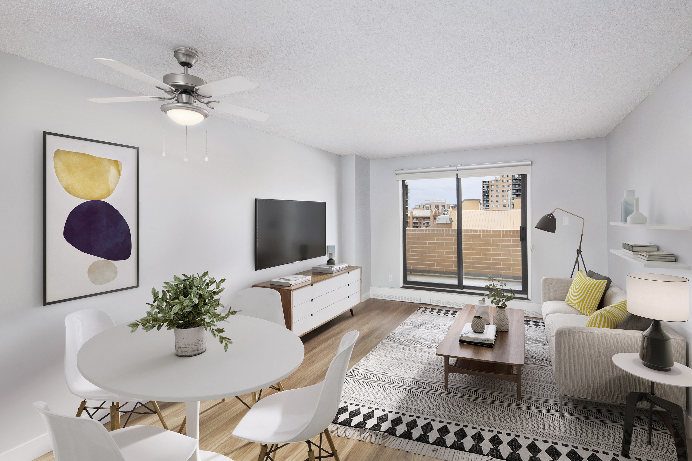 living room and dining room with balcony door, TV, dining table,  coffee table and couch
