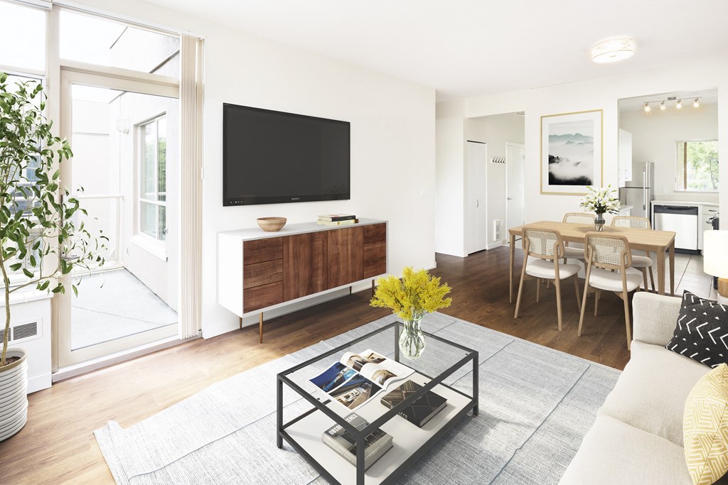 a living room with a couch and a coffee table and a television