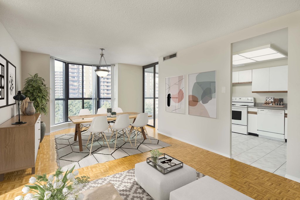 a living room and dining room with a table and chairs