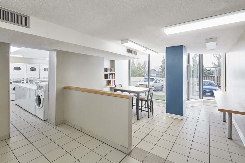 this is a photo of a kitchen and laundry room in a house